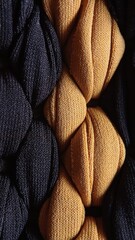 Close-up macro shot of a tightly braided yellow and black fabric, showcasing intricate textile details and texture
