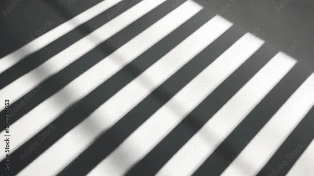 Aufkleber light and shadow create an artistic pattern on a sidewalk during bright daylight