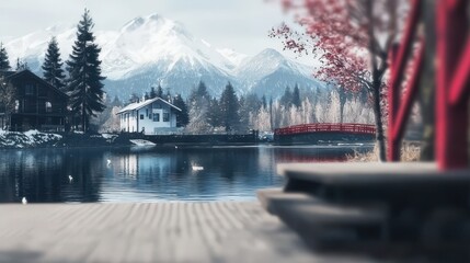 Fototapeta premium Snowy mountain lake, red bridge, houses