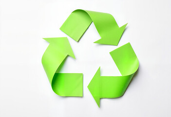 Obraz premium Close-up of bright green recycling symbol made of textured paper on white background