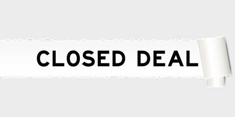 Ripped gray paper background that have word closed deal under torn part