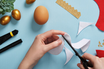 DIY Easter Egg King. Step-by-step instructions. Step 4. From white felt or fur, cut a semi-circular...