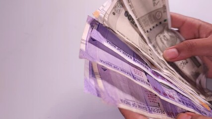 woman's hands counting Indian currency notes  Indian cash money of 500, 200 and 100 rupees