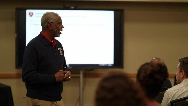 A man giving a presentation to an audience.