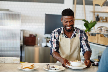 Man, barista and food process in restaurant, professional and hospitality service with meal preparation. Production, black person and employee in cafe for lunch, small business and server at bistro