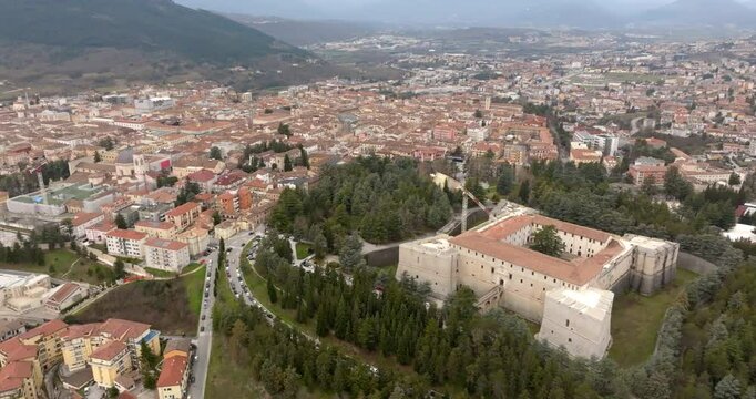 Aerial view of the Spanish Fort of L'Aquila, Abruzzo, central Italy. The Spanish Fort is a medieval and quadrangular castle. In background is the historic center of the city.