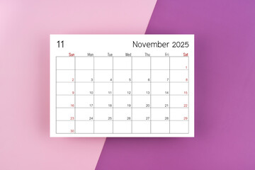 November 2025 calendar page on purple two tone color background.