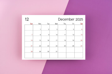 December 2025 calendar page on purple two tone color background.