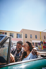 Happy couple, car and driving in city, map and road trip for romantic journey on highway. Black...