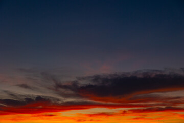 orange clouds at sunset. Partly cloudy sky