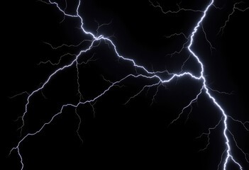 Bright jagged lightning flashes across dark sky illuminating night with electric power and energy