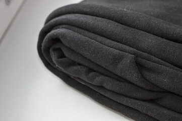 stacked fabric yellow black fashion sustainability material quality textile industry clothing...