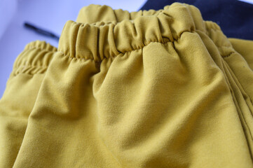 stacked fabric yellow black fashion sustainability material quality textile industry clothing...