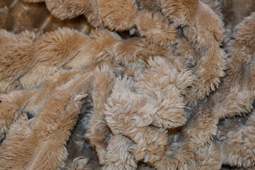 plush textured fabric in a warm beige or camel color material ultra-soft raised ribbed pattern cozy blankets throws winter luxury comfort home decor interior design cold-weather fashion tactile relax