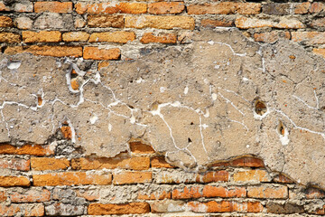 Old Weathered Brick Wall with Cracked Plaster Texture and Detail