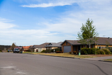 Wobbly skid mark lines on road in front of houses