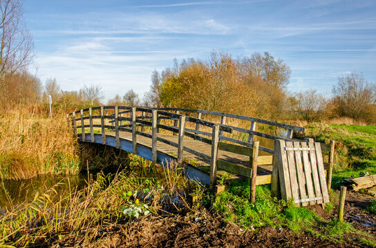 Puttershoek, The Netherlands, December 1, 2024: wooden bridge as part of a kining trail through the countryside around the village