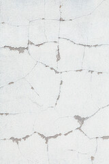 old white paint peeling at the wall