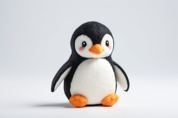 Obraz premium there is a small penguin that is standing on a table