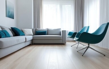Modern light-filled living room with sectional sofa, teal accent chairs, and hardwood floors.