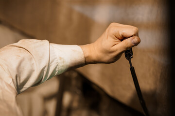 Craftsmanship in Action: Close-up of an Artist's Hand at Work