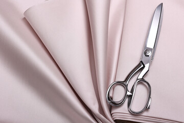 Top down view of pastel pink, luxurious, twirled, flat lay, brocade fabric with satin finish....