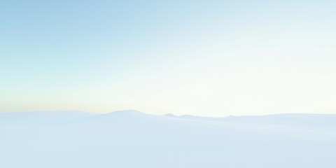 Obraz premium Gentle mountain silhouette in foggy dawn landscape. Pale blue sky with soft gradient hues. Distant peaks in misty valley. Natural scenery with hazy horizon. Subtle light tones in serene outdoor vista.