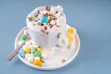 Easter hot chocolate with whipped cream, marshmallow and crushed chocolate eggs