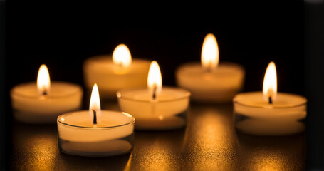 small burning candles in the dark