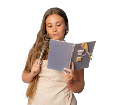 Young girl holding and posing with kitchen utensils over transparent background. PNG transparent