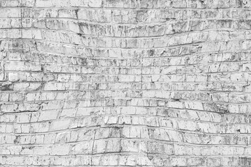 Old wall made of red brick, painted white in loft style