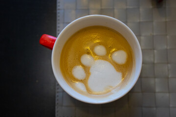 Latte art dog paw coffee