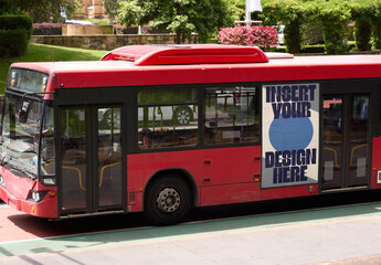 Public Transport Bus Navigating Through the Urban Streets of Sydney During a Sunny Day
