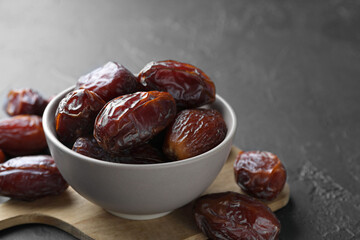 Tasty dried dates on grey table, closeup