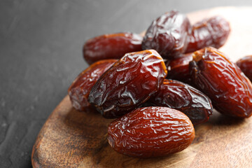 Tasty dried dates on grey table, closeup