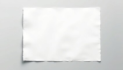 Sheets of textured white paper on soft gray table background. Horizontal orientation
