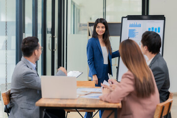 Motivated businessman leads a business meeting with the manager. Speech. Using television presentation with statistics.  Using graphs and charts for effective strategies