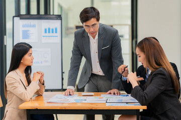 Motivated businessman leads a business meeting with the manager. Speech. Using television presentation with statistics.  Using graphs and charts for effective strategies