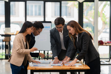 Motivated businessman leads a business meeting with the manager. Speech. Using television presentation with statistics.  Using graphs and charts for effective strategies