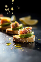 Mini Toasts with Tuna Fish, Avocado and Lemon. Healthy Tasty Snack