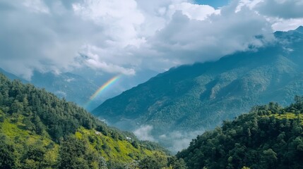 Naklejka premium Breathtaking Rainbow Over Vibrant Mountain Landscape Unfolds