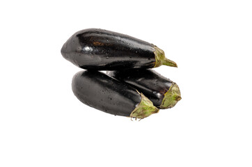 Three black eggplants are sitting on a white background. The eggplants are all different sizes and are all facing the same direction