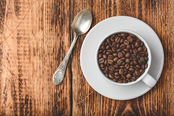 Roasted coffee beans in cup