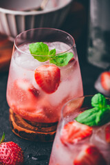 Cocktails with strawberry, gin and tonic