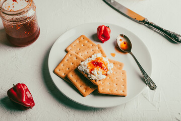 Crackers with Habanero Pepper Jam and Ricotta Cheese