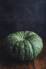Big homegrown pumpkin on rustic table