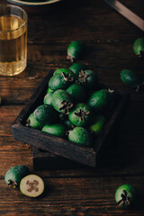 Feijoa fruit in a rustic wooden box