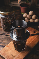 Preparing coffee in Vietnamese drip filter