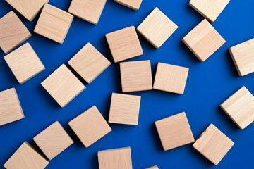Scattered Wooden Blocks on Blue Background Illustration