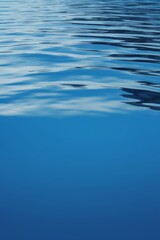 there is a small boat floating on the water in the ocean